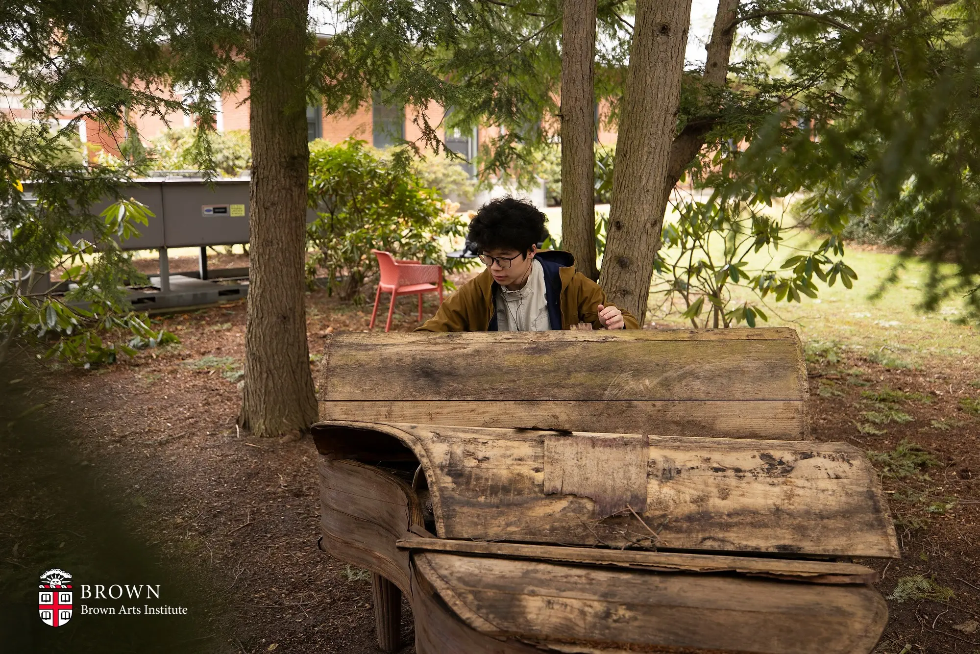 Henry Wang playing piano (de)composition, an outdoor piano and an installation by Devanney Haruta at Brown University, as part of his piano improvisation project "being"